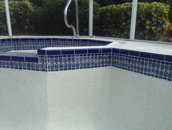 resurfacing residential pool with mosaic tiles - Pool Renovation & Repair | Stahlman Pool Company - Naples, Florida