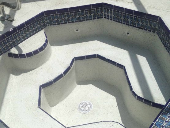 resurfacing residential pool with mosaic tiles - Pool Renovation & Repair | Stahlman Pool Company - Naples, Florida